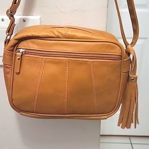 Cowhide leather crossbody purse. Natural leather color.